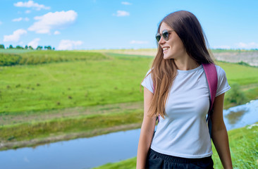 Girl with a backpack on the back 