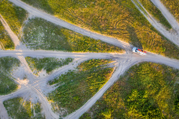 SUV on sandy trails aerial view