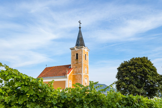Lengyel-Chapel with grape vines in the foreground in the village of Hegymagas, situated on Saint George Hill near Lake Balaton, Hungary