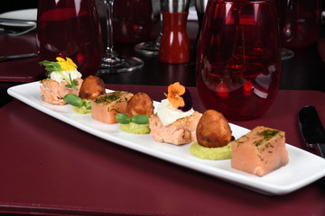 Fried scallops with green peas puree. Elegant and luxury haute cuisine plating in a luxury restaurant setting. Top view, copy space