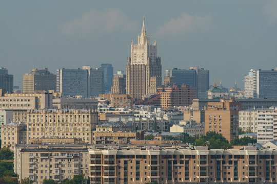 Moscow cityscape in summer sunny day. The highest building is the Ministry of Foreign Affairs building. View from above. High resolution image.