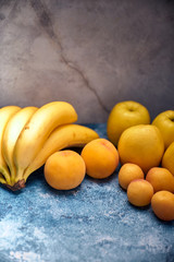 view of several ripe yellow and orange fruits