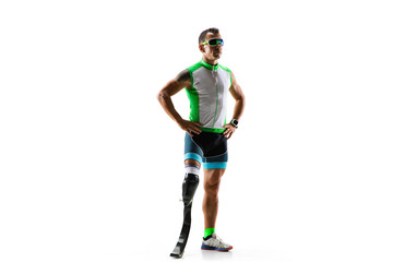 Athlete with disabilities or amputee isolated on white studio background. Professional male runner with leg prosthesis training and practicing in studio. Disabled sport and healthy lifestyle concept.