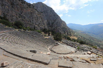 Fototapeta na wymiar Delphi, Greece - July 19, 2019: The archaeological site of Delphi, seat of the oracle of the god Apollo