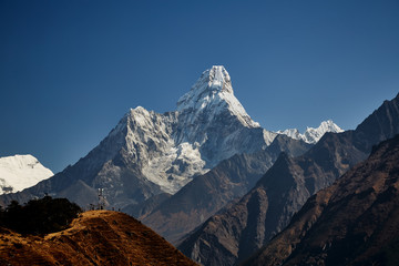 The Ama Dablam massif against the blue sky on beautiful sunny day.