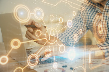 Social network theme hologram with businessman working on computer on background. Concept of world wide web. Double exposure.