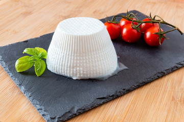 Composition of tomatos, basil and ricotta cheese handmade in Puglia, Italy