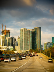 Traffic on the highway with downtown Miami's skyscrapers on the background