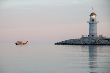 Fototapeta premium Lighthouse beach sunset