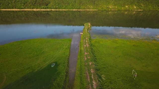Flying over the river on a sunny summer day. Dniester river of Moldova republic.