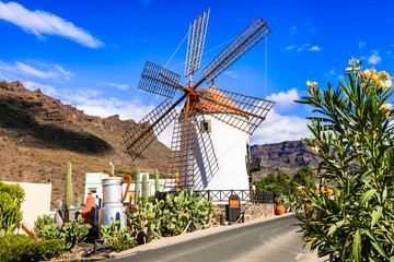 Traditional village Mogan with old windmill , Canary island. Gran Canaria travel - obrazy, fototapety, plakaty