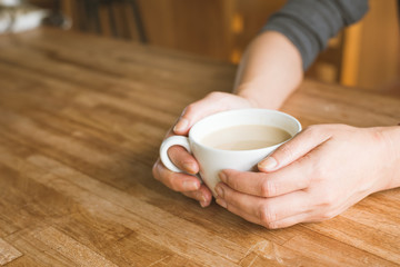 woman hold a cup a coffee