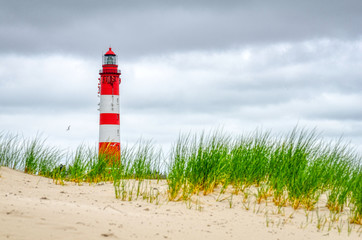 red white lighthouse on the north sea