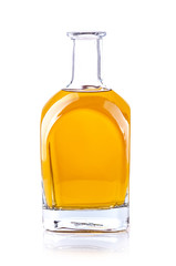 glass bottle with a yellow liquid on white background