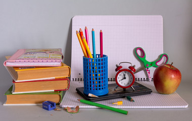 Textbooks, notebooks, pencils, notebook and apple. You can add your text.