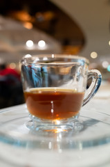 cup of coffee in glass on table