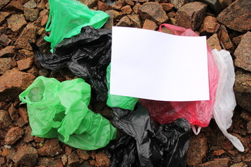 A bunch of reusable, multi-colored plastic bags polluting the environment.