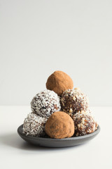 Homemade energy balls with cacao, coconut. Healthy food for children and vegan, sweets substitute.