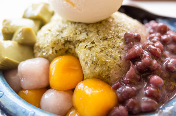 eating shaved ice with colorful dessert