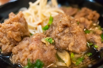 Taiwanese food of soup noodles with pork ribs cakes