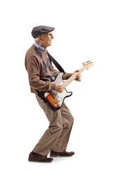 Senior man playing an electric guitar