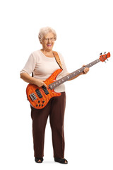 Senior woman with an electric bass guitar smiling at the camera