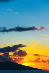 Stunning beautiful sunset on an exotic beach in Seychelles