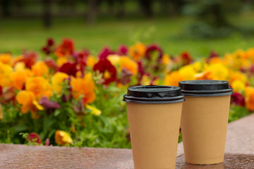 paper cups with coffee in the fresh air