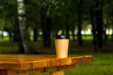 Naklejka premium paper cup with coffee for fresh air