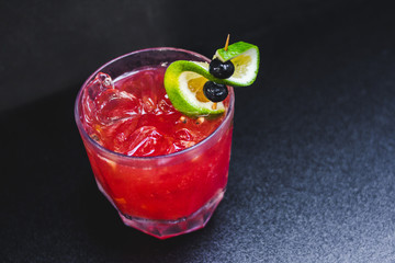 red ice cocktail with berry 
