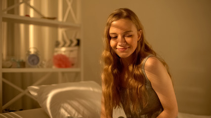 Naklejka premium Young lady dreaming at home and feeling inspired, thinking of boyfriend, leisure