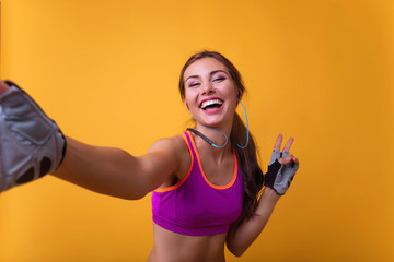 Fitness selfie woman self portrait after workout. Sport athlete taking selfies photo after working out running and training outdoors. Young sporty hispanic woman taking selfie