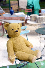 old teddy bear on display at flea market in France