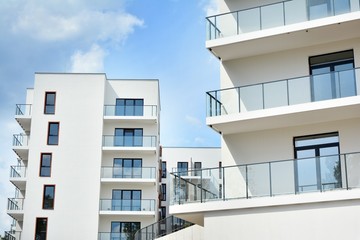 Multistory new modern apartment building. Stylish living block of flats.