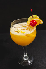 cocktail with orange and cherry