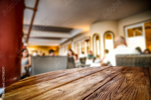 Wooden Table Top Background In The Rastaurant Blurred Restaurant View Wooden Top Board Empty Space For An Advertising Product Wall Mural Magdal3na