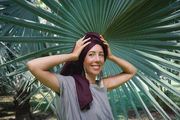         woman on the background of palm trees            