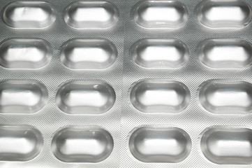 Tablets capsules in silver packaging pills for medicine design background