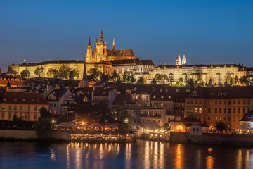 Fototapeta na wymiar Prague Castle and Charles Bridge in the evening, Prague, Czech Republic, Vltava river in foreground.