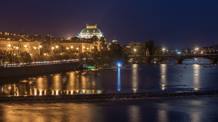 Fototapeta na wymiar Vltava river and cityscape of Prague in the evening. Czech Republic.