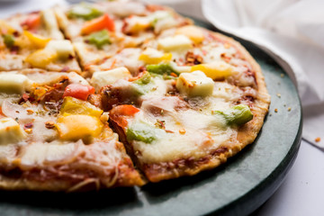 Chapati Pizza made using leftover Roti / Paratha with Cheese, vegetables, paneer and Sausage