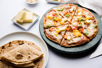 Chapati Pizza made using leftover Roti / Paratha with Cheese, vegetables, paneer and Sausage