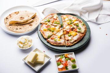 Chapati Pizza made using leftover Roti / Paratha with Cheese, vegetables, paneer and Sausage