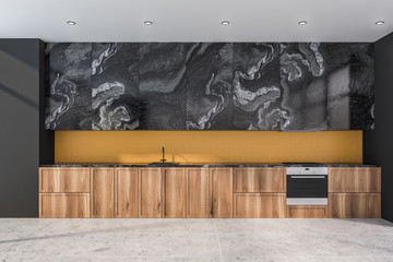 Black marble and yellow kitchen with countertops