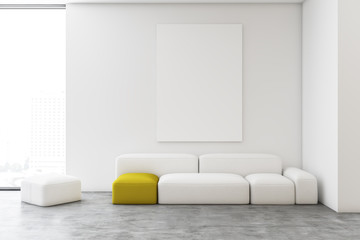 White living room with sofa and poster