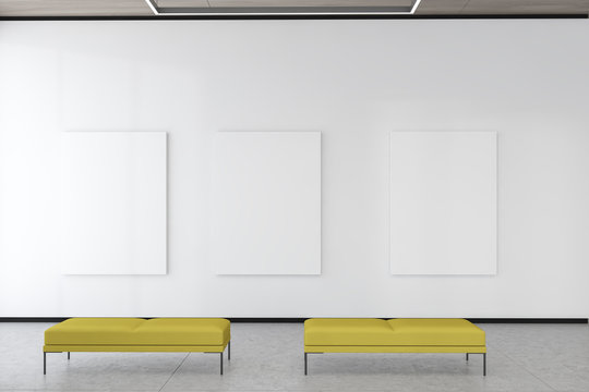 Three mock up posters in white gallery interior