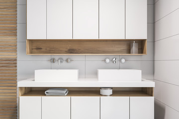 White tile and wood bathroom, double sink