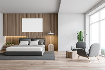 White and wood bedroom interior, poster, armchairs