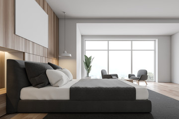 Side view of white and wooden bedroom