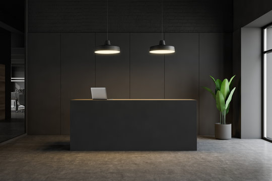 Dark gray reception desk in modern office